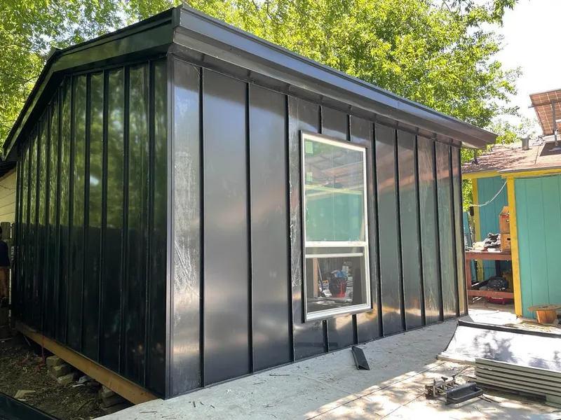 Black standing seam metal wall panels for Roof Inspection in Delano